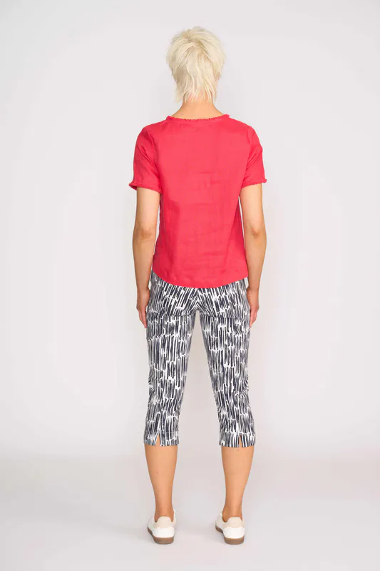 Model wearing Coral V Benefits Top By Foil Available at Beetees Nelson