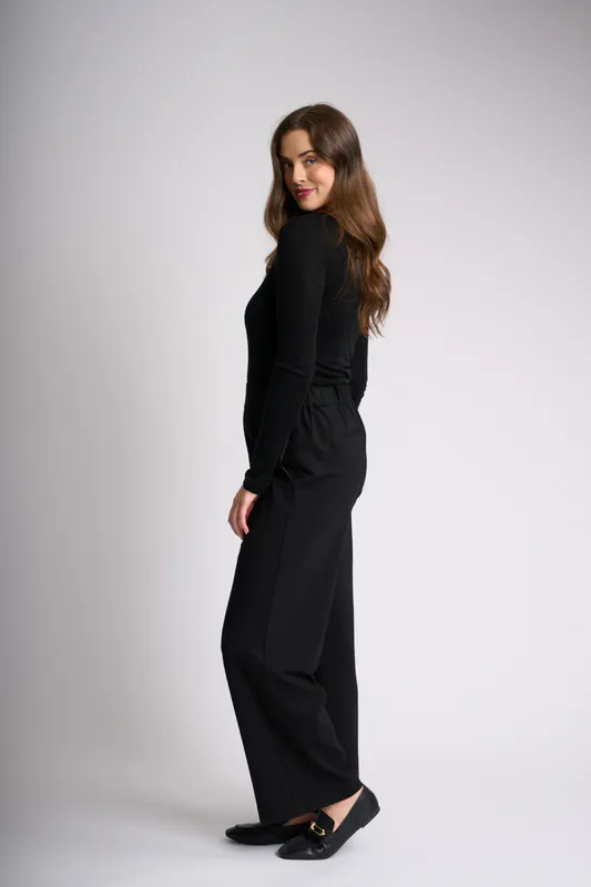 Model wearing Black Essential Crew Neck Top By Foil Available at Beetees Nelson