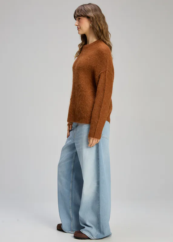 Model wearing Toffee Alpaca Jumper By Zaket & Plover Available at Beetees Nelson