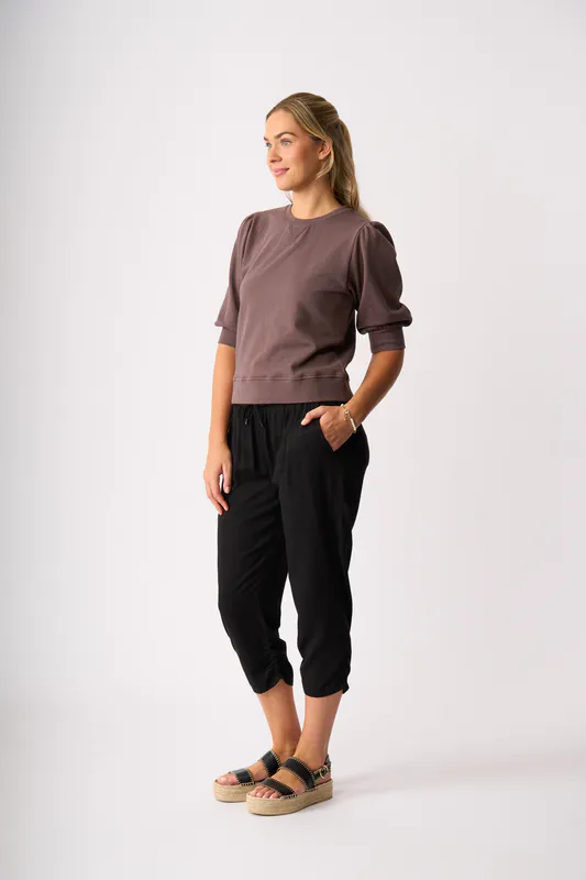 Model wearing Black Draped Cuff Trousers By Memo Available at Beetees Nelson