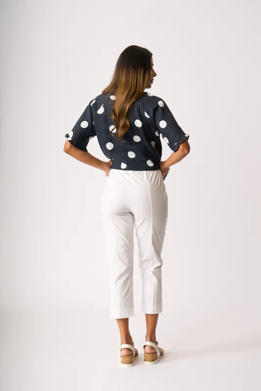Model wearing True Navy Spot Ruffles & Scoop Hem Top By Foil Available at Beetees Nelson