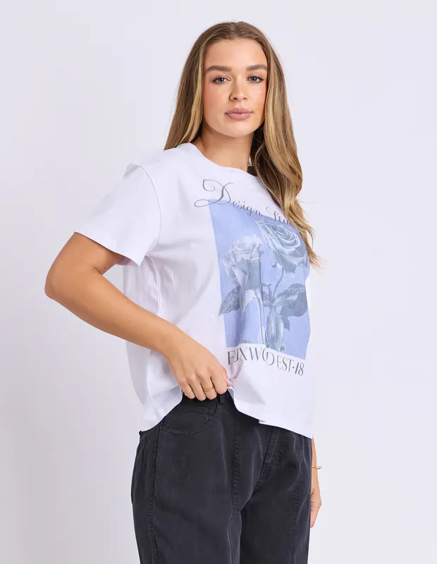 Model wearing Cornflower Blue Studio Rose Tee By Foxwood Available at Beetees Nelson