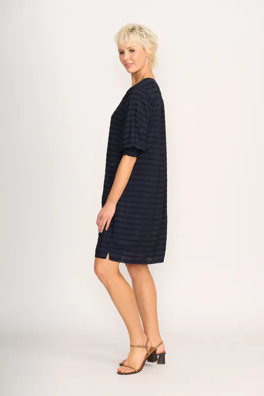 Model wearing Navy Stripe For Shirr Dress By Preen Available at Beetees Nelson