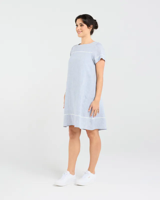 Model wearing Sky Blue CD Martine Ladder Trim Dress By Blackstone Available at Beetees Nelson