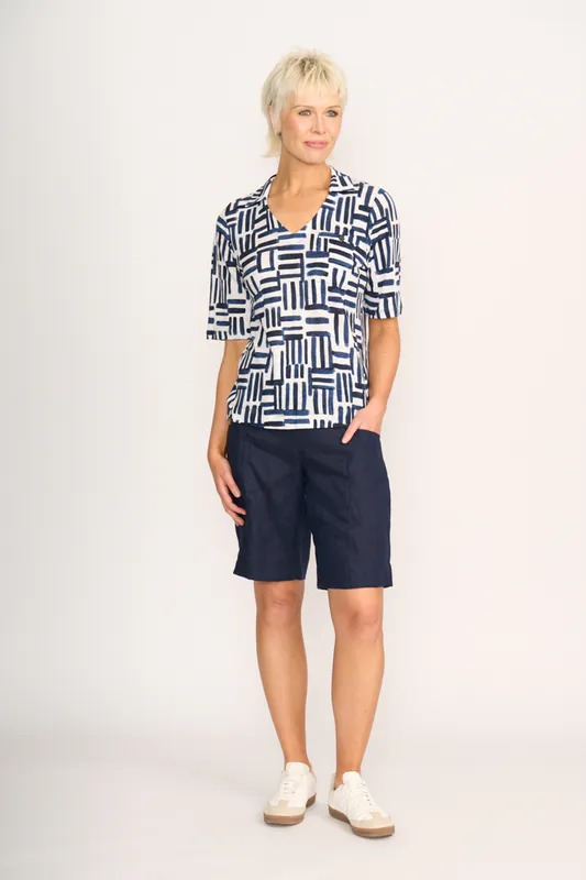 Model wearing Block & Roll Team Player Top By Foil Available at Beetees Nelson