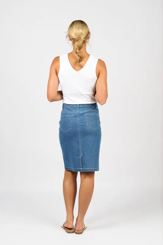 Model wearing Blue Hue Plain Denim Skirt with Back Vent By Vassalli Available at Beetees Nelson