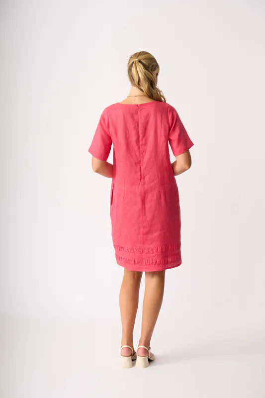 Model wearing Coral Crowd Pleaser Dress By Foil Available at Beetees Nelson