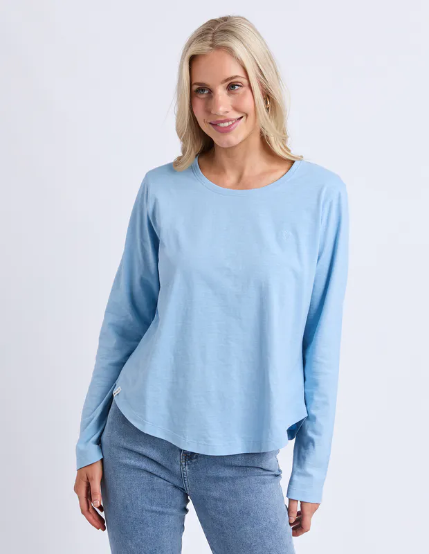 Model wearing Light Blue Everyday Long Sleeve By Elm Available at Beetees Nelson