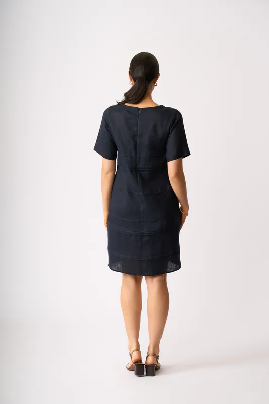 Model wearing True Navy Crowd Favourite Dress By Foil Available at Beetees Nelson
