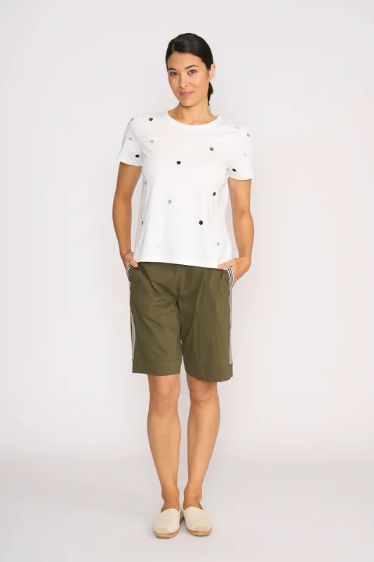 Model wearing White Spot T-Shirt- Embroidery By Memo Available at Beetees Nelson