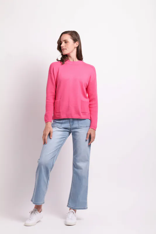 Model wearing Pink High Neck Button Back Jumper By Memo Available at Beetees Nelson