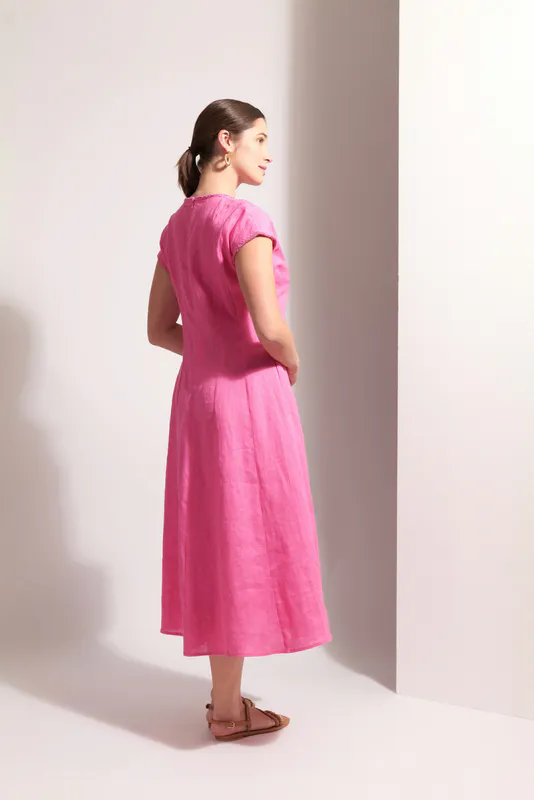 Model wearing Pink Festival Event Dress By Foil Available at Beetees Nelson