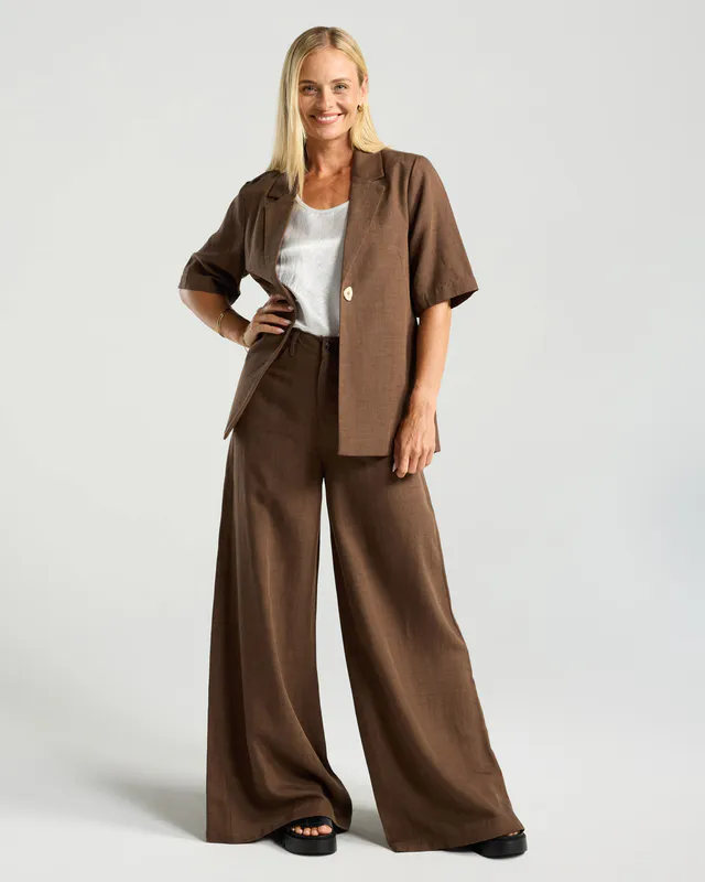 Model wearing Chocolate Francesca Linen Blazer By Blackstone Available at Beetees Nelson