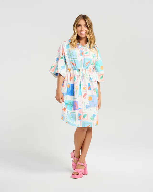 Model wearing Holiday Shells Peyton Dress By NMBR Rose Available at Beetees Nelson