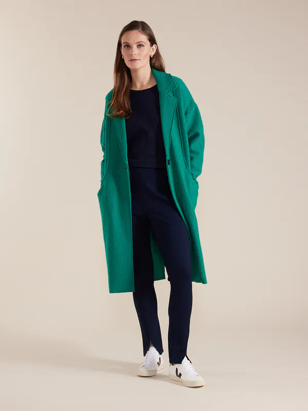 Model wearing Green Long Sleeve Boiled Wool Coat By Marco Polo Available at Beetees Nelson