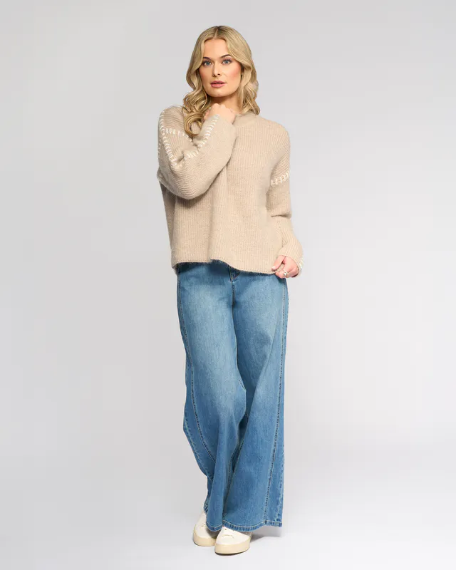 Model wearing Oat/Winter White Lennox Sweater By Knewe Available at Beetees Nelson