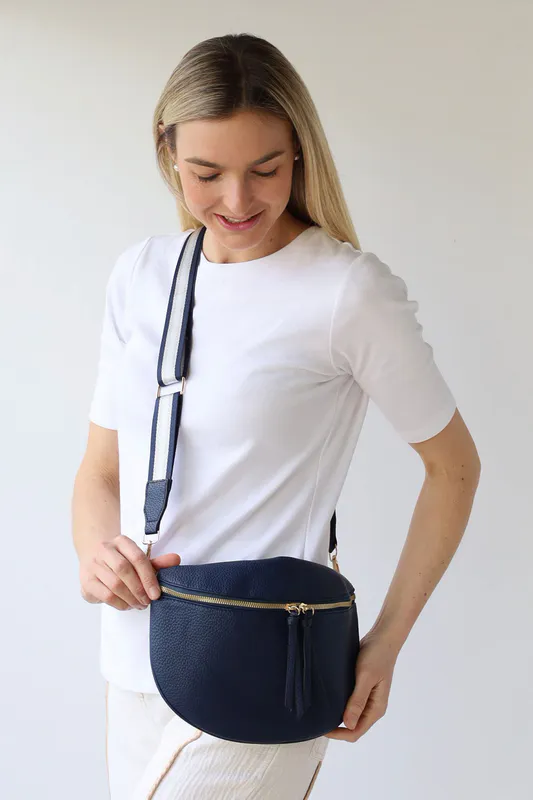 Model wearing Navy Cross Body Zip Detail Bag By Archer House Available at Beetees Nelson