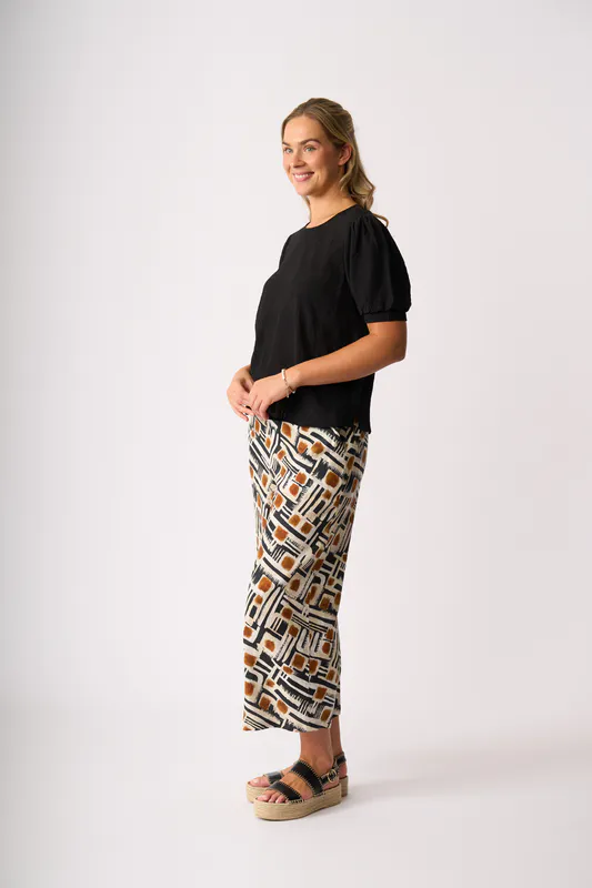 Model wearing Toffee Maze Wide Leg, Cropped Trousers By Foil Available at Beetees Nelson