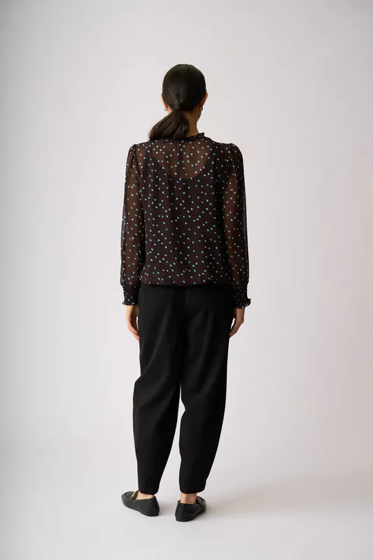 Model wearing Sky Coco Spot Pintuck Front, Shirred Cuff Blouse By Memo Available at Beetees Nelson