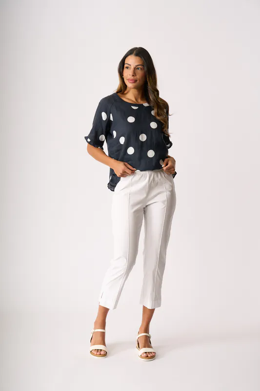 Model wearing True Navy Spot Ruffles & Scoop Hem Top By Foil Available at Beetees Nelson
