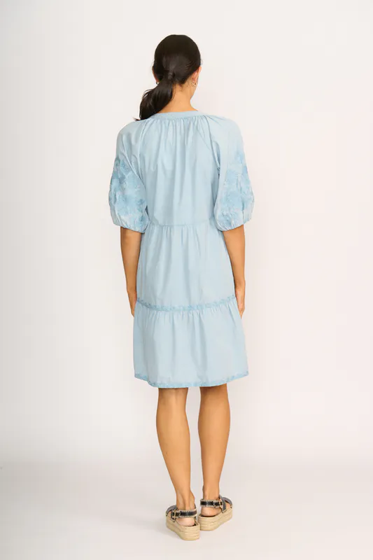 Model wearing Blue Embroidered Tiered Dress By Foil Available at Beetees Nelson