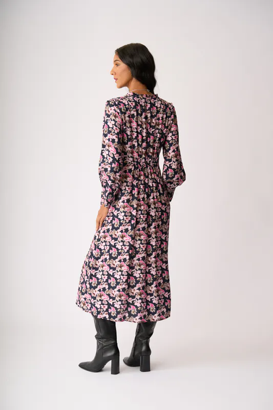 Model wearing Floral Smudge Shirred Shoulder Dress By Foil Available at Beetees Nelson