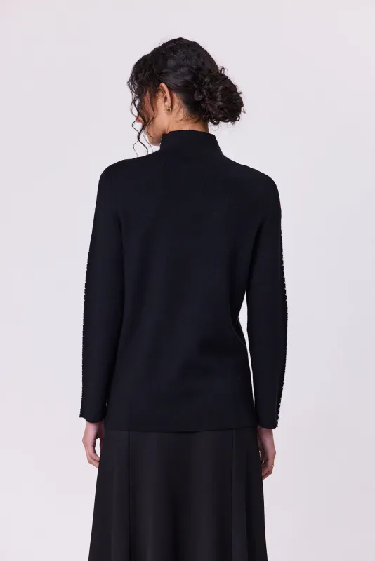 Model wearing Black Astral Turtle Knit By Navy & Co. Available at Beetees Nelson