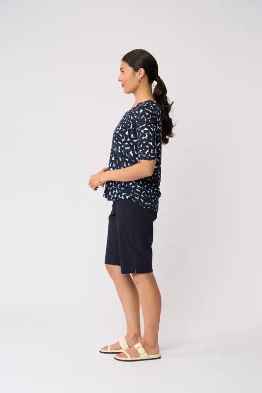 Model wearing Art Style Glow On Top By Foil Available at Beetees Nelson