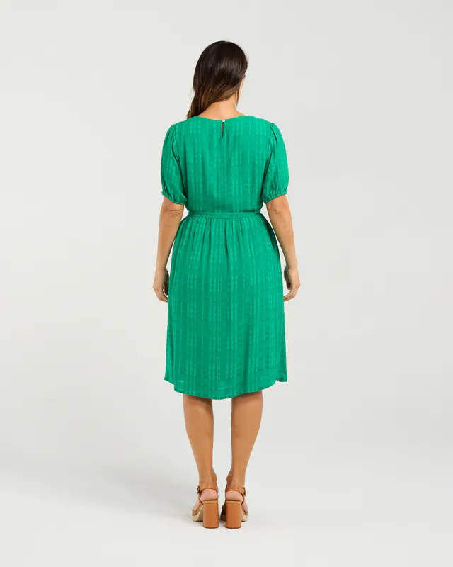 Model wearing Green Joana Dress By Seduce Available at Beetees Nelson