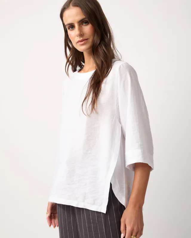 Model wearing White Skye Top By Yarra Trail Available at Beetees Nelson