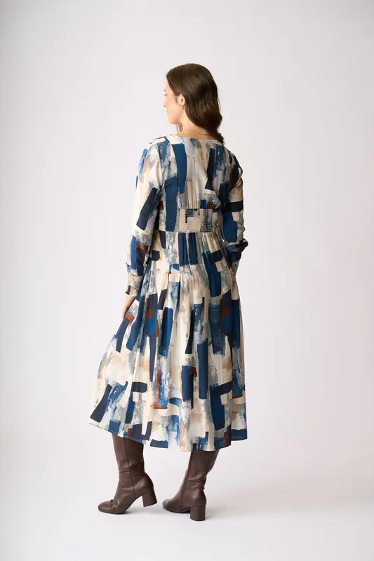 Model wearing Modern Art Pleats Please Dress By Preen Available at Beetees Nelson