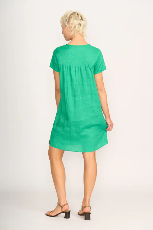 Model wearing Green Dress - Panel Lines By Foil Available at Beetees Nelson
