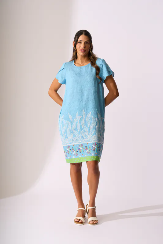 Model wearing Birds of Paradise Tulip Sleeve Dress By Foil Available at Beetees Nelson