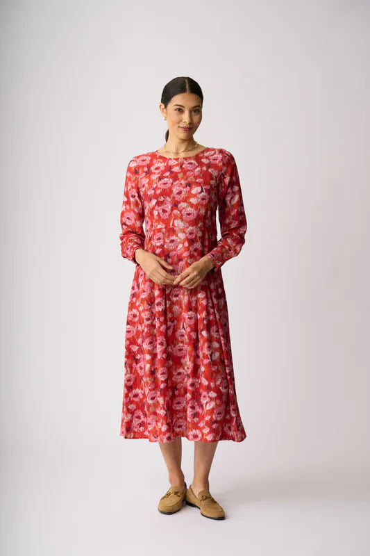 Model wearing Winter Blooms Pleats Please Dress By Preen Available at Beetees Nelson