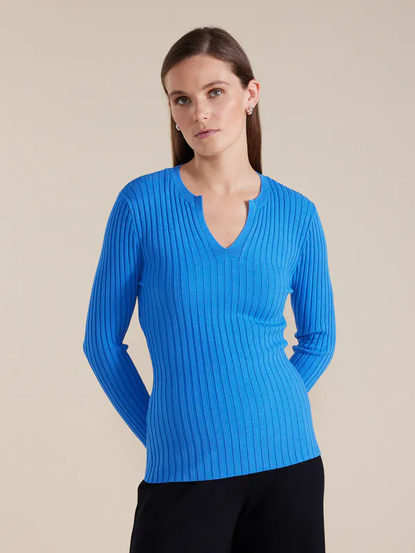 Model wearing Blue Essential Rib Knit Henley By Marco Polo Available at Beetees Nelson