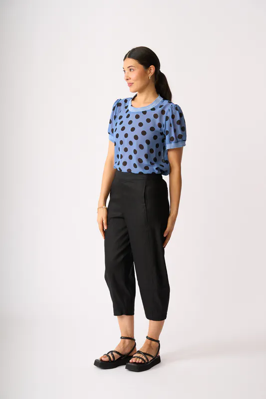 Model wearing Black Barrel Along Trousers By Oh Three Available at Beetees Nelson