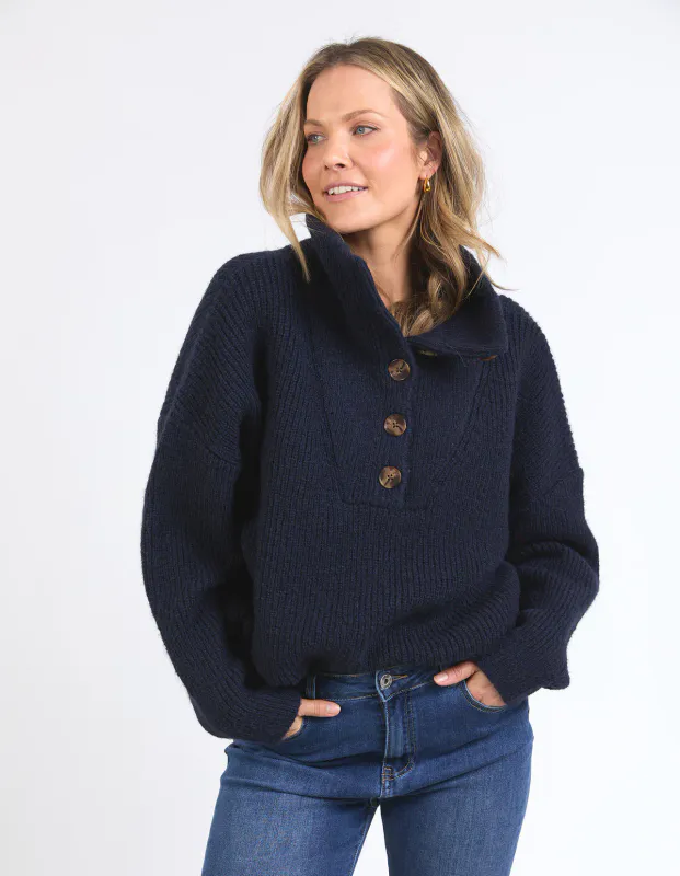 Model wearing Navy Bron Button Knit By Elm Available at Beetees Nelson