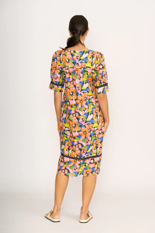 Model wearing Summer Burst Trim Time Dress By Foil Available at Beetees Nelson