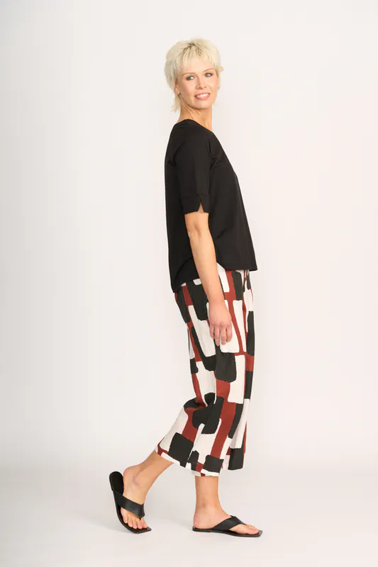 Model wearing Black Tee - Wide Neck, Elbow Sleeve By Esplanade Available at Beetees Nelson