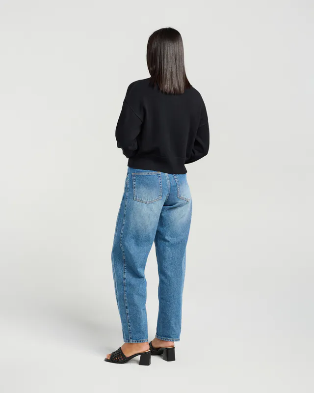 Model wearing Black Poppy Cardi By Et Alia Available at Beetees Nelson