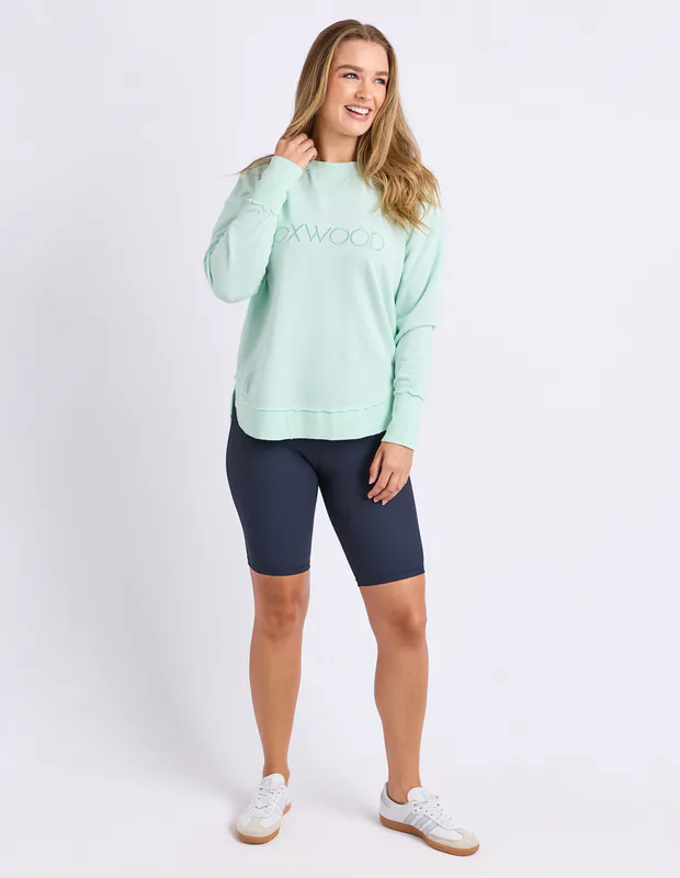 Model wearing Neon Blue Simplified Crew By Foxwood Available at Beetees Nelson