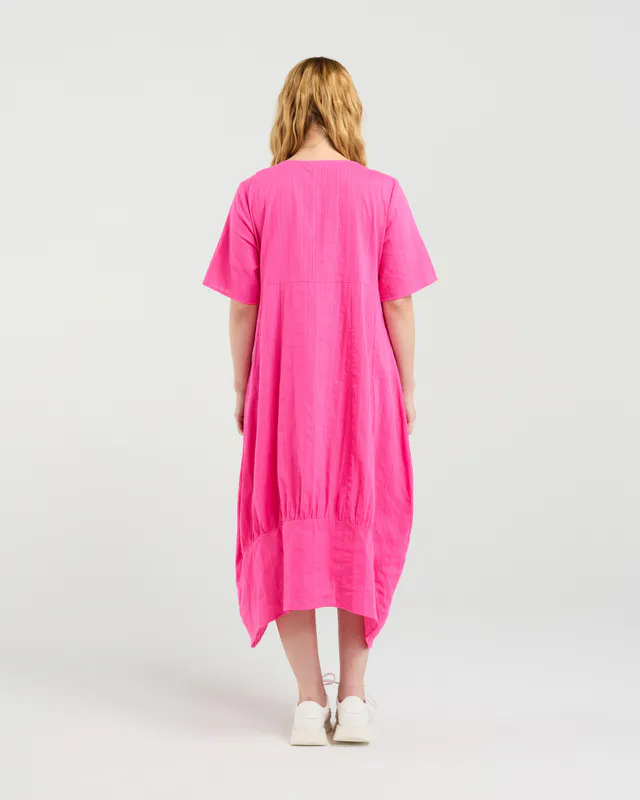 Model wearing Hot Pink Selena Dress By Seduce Available at Beetees Nelson