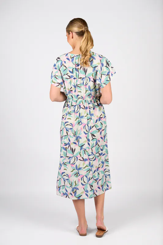 Model wearing Soleil Drop Shoulder Dress with Wrap Bodice and Side Pockets By Vassalli Available at Beetees Nelson