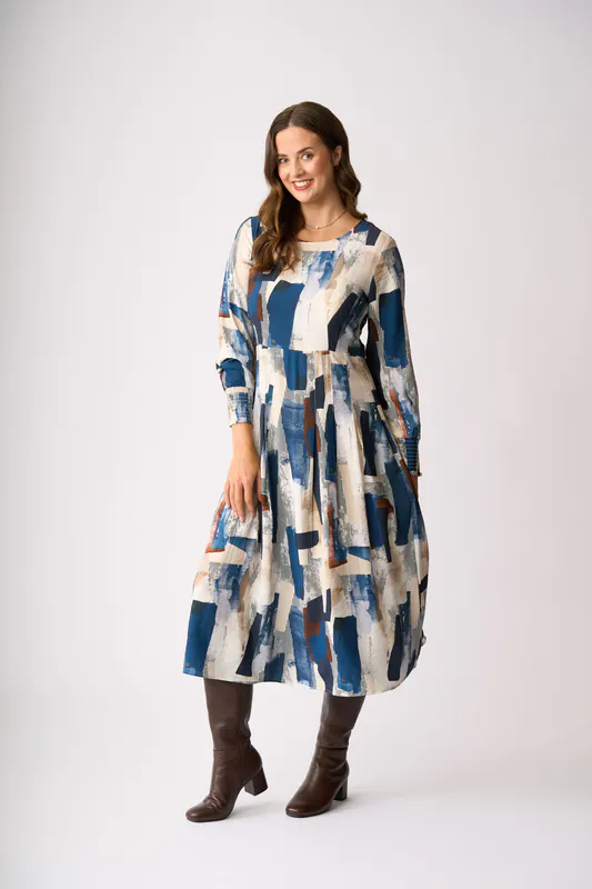 Model wearing Modern Art Pleats Please Dress By Preen Available at Beetees Nelson