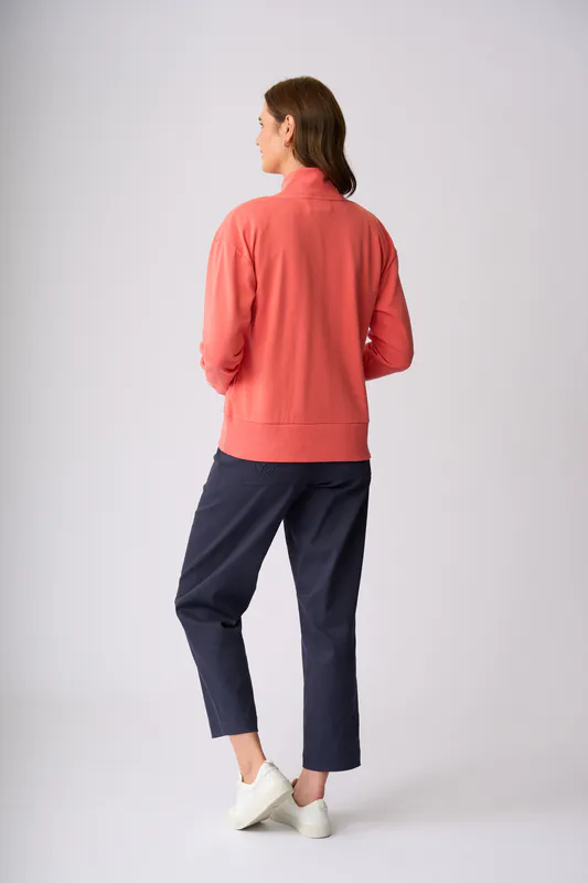 Model wearing Coral Flaxton 1/2 Zip Sweat By Charlie Jane Available at Beetees Nelson