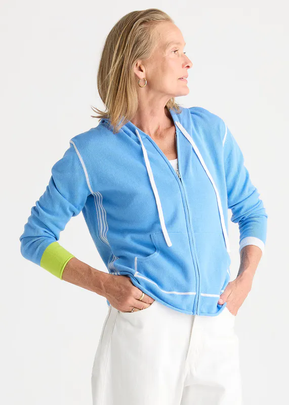 Model wearing Cornflower Sports Hoodie By Zaket & Plover Available at Beetees Nelson