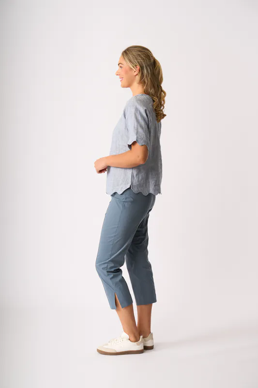 Model wearing Pale Blue Cross Dye Scalloped Top By Foil Available at Beetees Nelson
