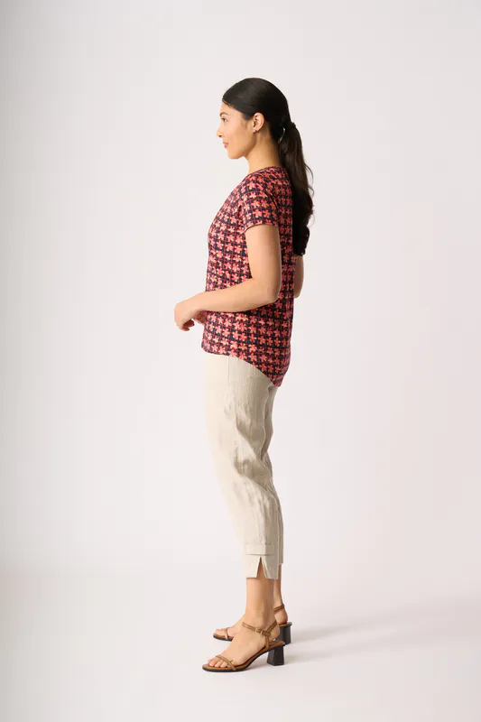 Model wearing Retro Hibiscus Round Neck Tee By Preen Available at Beetees Nelson