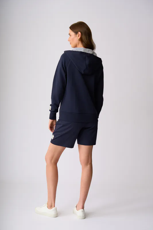 Model wearing Ink Tai Tapu Zip Sweat By Charlie Jane Available at Beetees Nelson