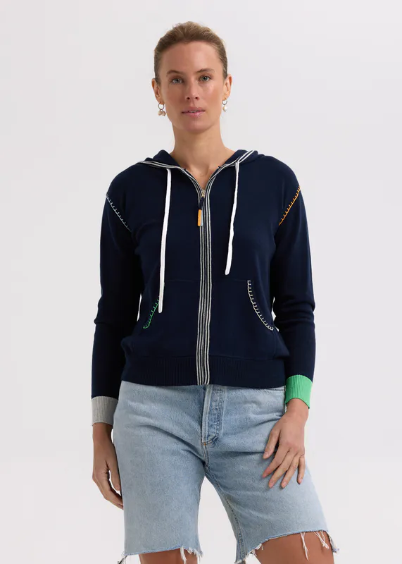 Model wearing Navy Heart Embroidery Hoodie By Zaket & Plover Available at Beetees Nelson
